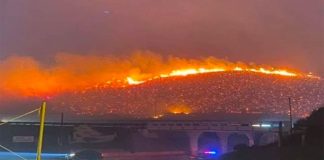 A wildfire burns yesterday in Tijuana.