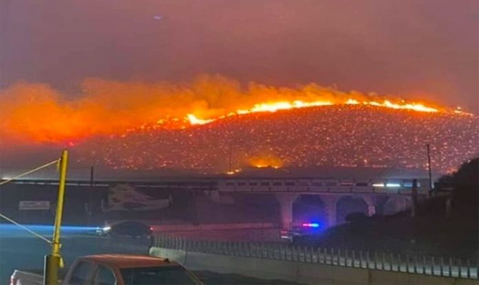A wildfire burns yesterday in Tijuana.