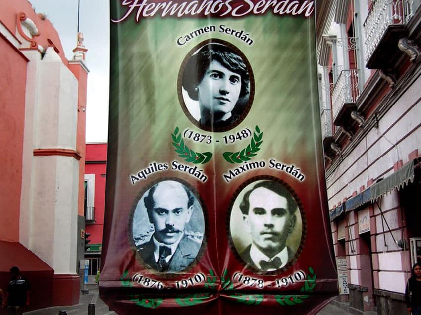 Banner with photos of the Serdán family celebrating the 100th anniversary of the Revolution.