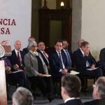 Cabinet secretaries listen as President López Obrador presents infrastructure plan.