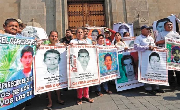 Parents of the missing students outside the National Palace after meeting with the president.