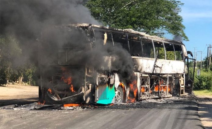 A bus burns on Friday in Petatlán, Guerrero.