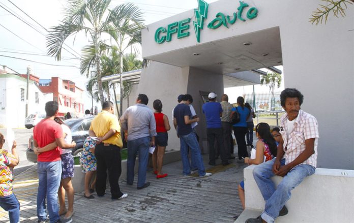 Customers line up to pay their electricity bills in Tabasco