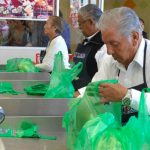 Seniors bag groceries in exchange for tips