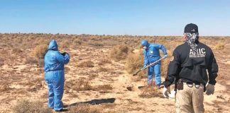 Officials at the site of Puerto Peñasco burial ground.