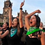 Women perform 'A rapist in your way' in the capital on Friday.