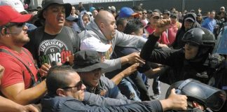 Cops vs. cops at Mexico City airport.