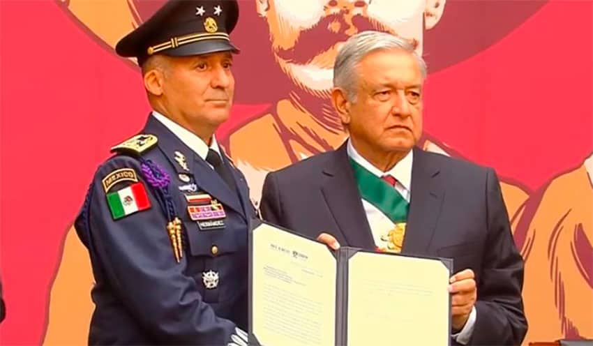 Air Force pilot Hernández receives his promotion for flying Bolivia's ex-president to Mexico.