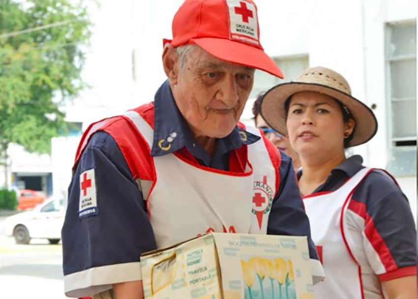 Comandante Pulido with boxes of earthquake aid two years ago.