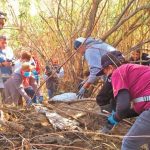 Searchers look for bodies Saturday in Tijuana.