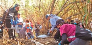 Searchers look for bodies Saturday in Tijuana.