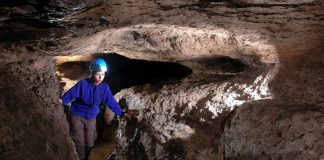 Cold Dunk Cave was formed in volcanic rock by water dissolving soluble material.