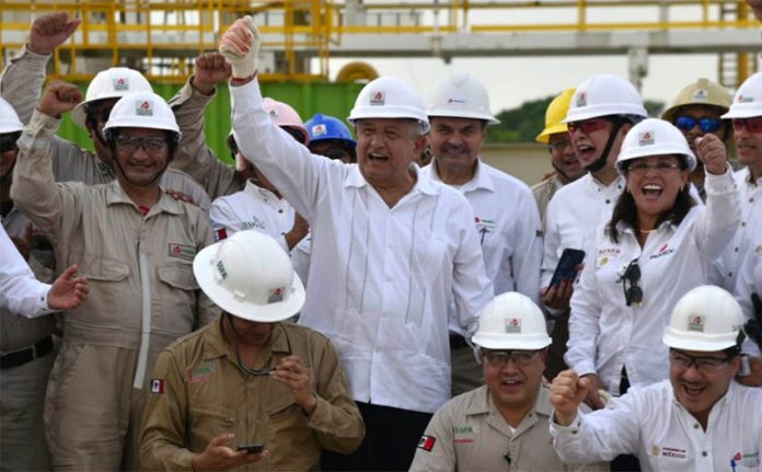 Cheering news: López Obrador celebrates oil discovery with Pemex workers in Tabasco.