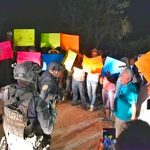 'Please don't leave:' residents attempt to prevent security forces from leaving danger area.