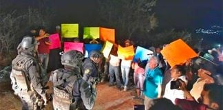 'Please don't leave:' residents attempt to prevent security forces from leaving danger area.