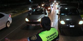 A traffic cop at a breath test stop in Cancún.