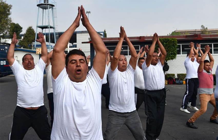 Officers take off weight with jumping jacks.