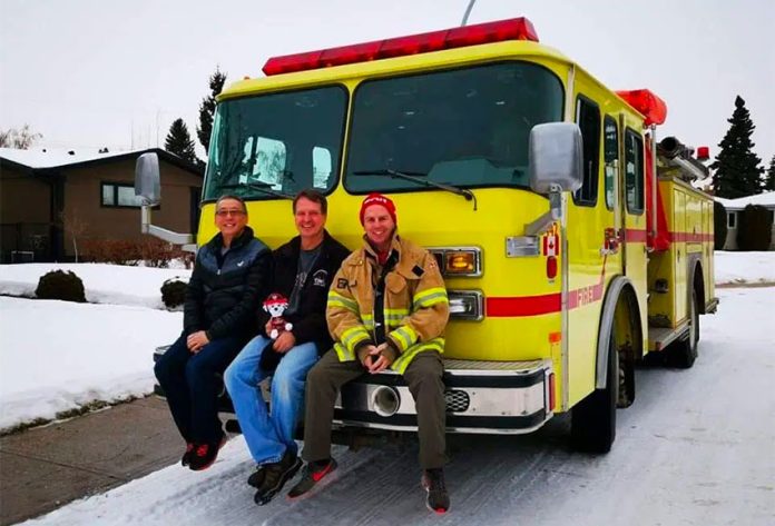 Poon, Volovich and Hardeman with Puerto Morelos' new fire truck.