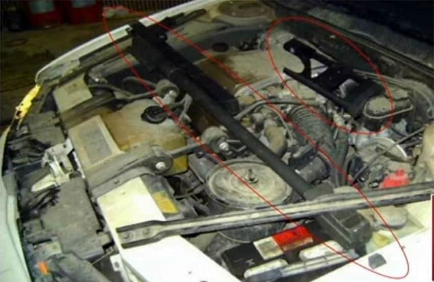 A 50-caliber rifle hidden under the hood of a car.