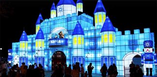 A castle on the lake is one of the attractions at Luztopía.