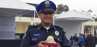 Officer Razo with his distinguished service award.