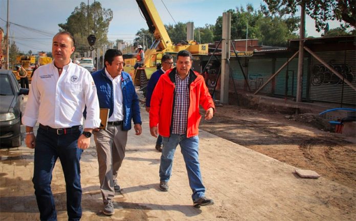 San Miguel's mayor inspects the paving project on Sunday.