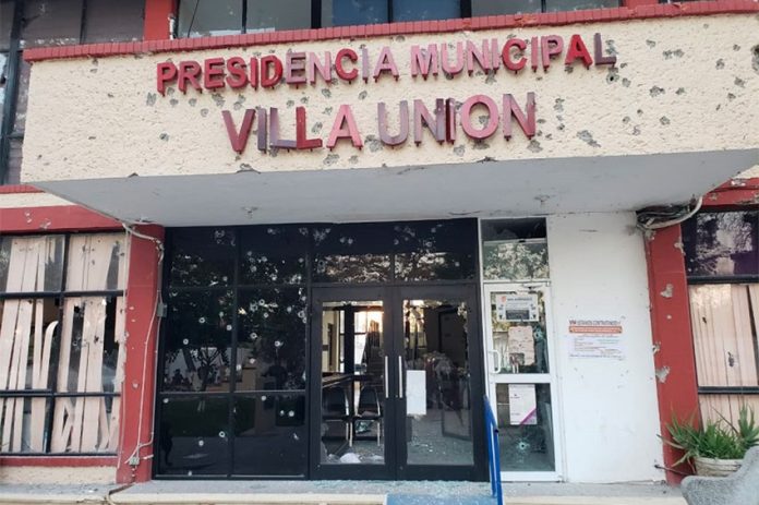 Battle-scarred municipal offices in Villa Unión.