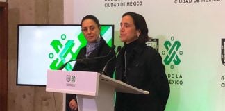 Mayor Sheinbaum, left, listens as Finance Secretary Luz Elena González announces spending plans.