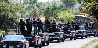 State police arrive in Cuitzeo after local cops arrested in murder case.