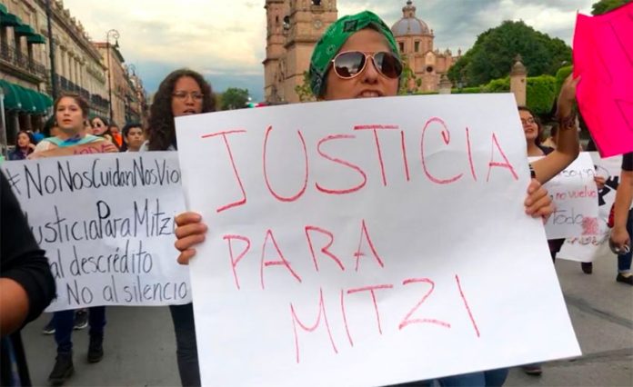 Protesters call for justice for a Michoacán journalist who was victim of an assault last September and then harassed by police.
