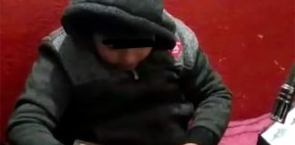 Juan Daniel opens a Kings Day gift.