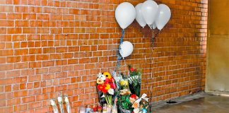 A memorial at the school where two people were killed and six wounded.