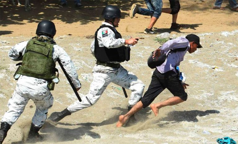 For his own protection, a migrant is chased by guardsmen at the southern border.