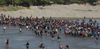 Migrants cross the Suchiate River at the Guatemala border.
