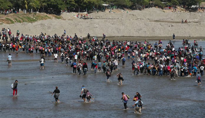 Migrants cross the Suchiate River at the Guatemala border.