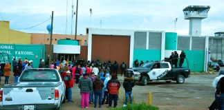 Inmates' families wait for news outside the Zacatecas prison.