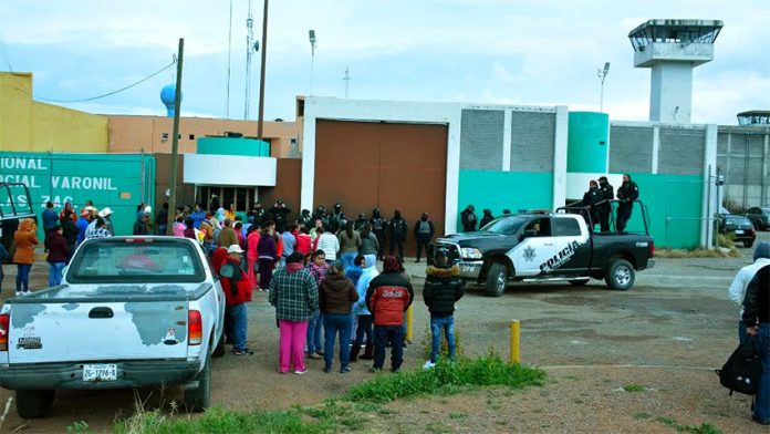 Inmates' families wait for news outside the Zacatecas prison.