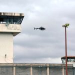 A helicopter flies over the Zacatecas prison where two riots have occurred this week.