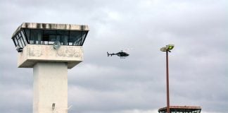 A helicopter flies over the Zacatecas prison where two riots have occurred this week.