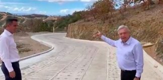 AMLO, right, and Oaxaca Governor Murat inspect the new road.