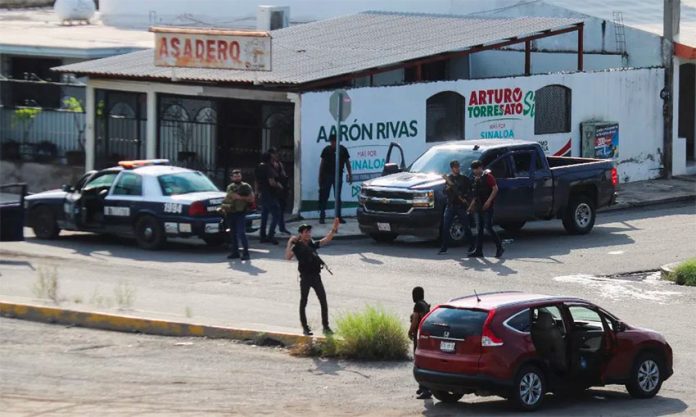 Cartel gangsters control a street corner in Culiacán in October.