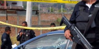 Police at the scene of one of several shootings this week in Tamaulipas.