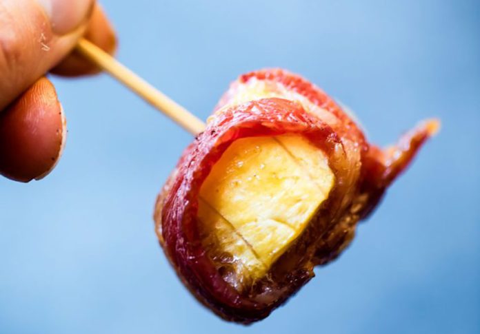 A tasty-looking bacon-wrapped plantain bite.