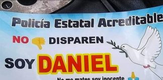 The bumper sticker asks police not to shoot.