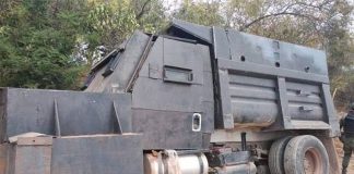 Repurposed dump truck served as gang's armored vehicle.