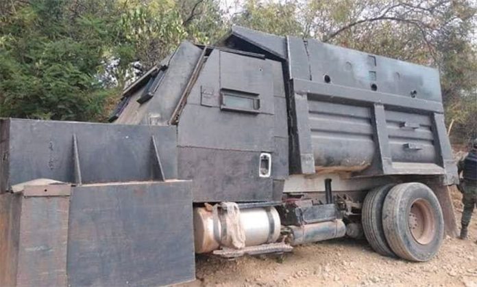 Repurposed dump truck served as gang's armored vehicle.
