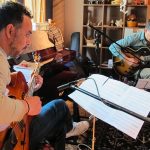 Aispuro, left, in the studio.