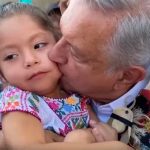 The president kisses a child in March, as the coronavirus outbreak was beginning.