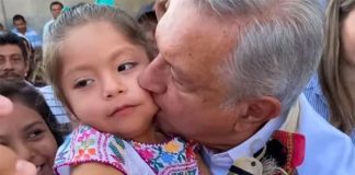 The president kisses a child in March, as the coronavirus outbreak was beginning.