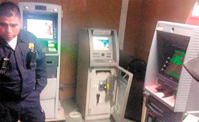 The 'doctors' had opened one ATM when an alarm sounded.
